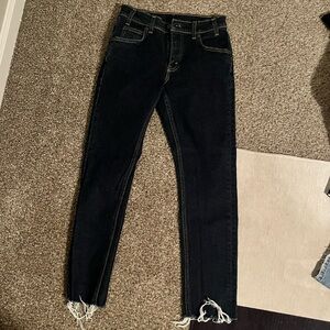 Levi’s blue jeans with frayed hem and pocket detail